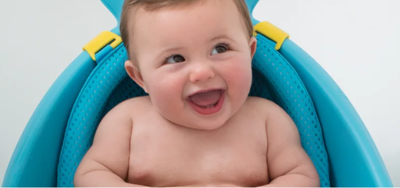 changing and bathing collection image child in bath seat