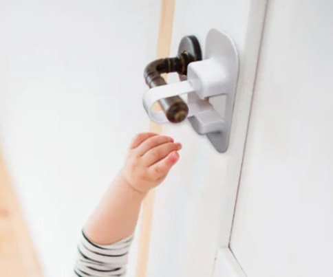 home safety collection image of child with door lock