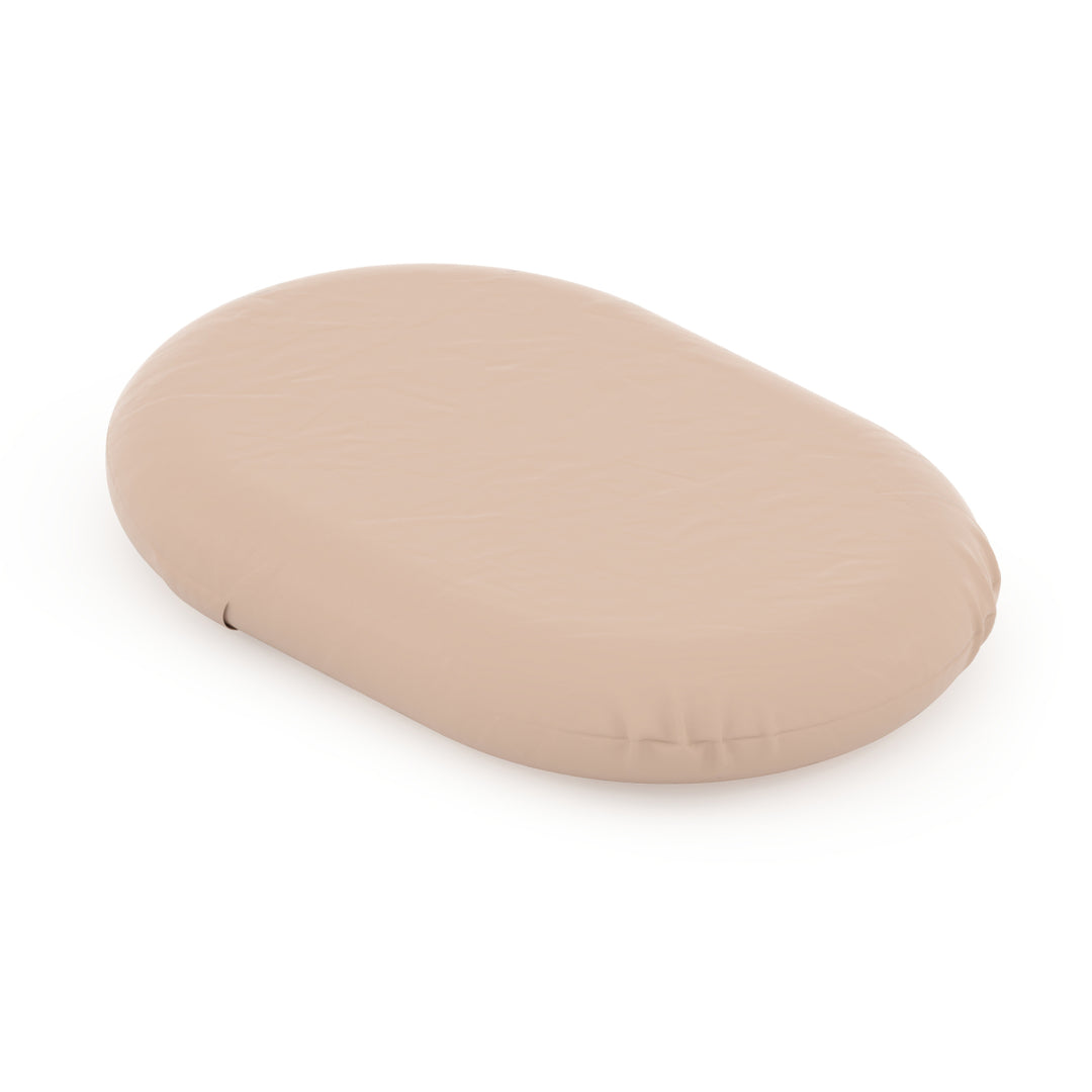 Beige oval-shaped object on a white background
