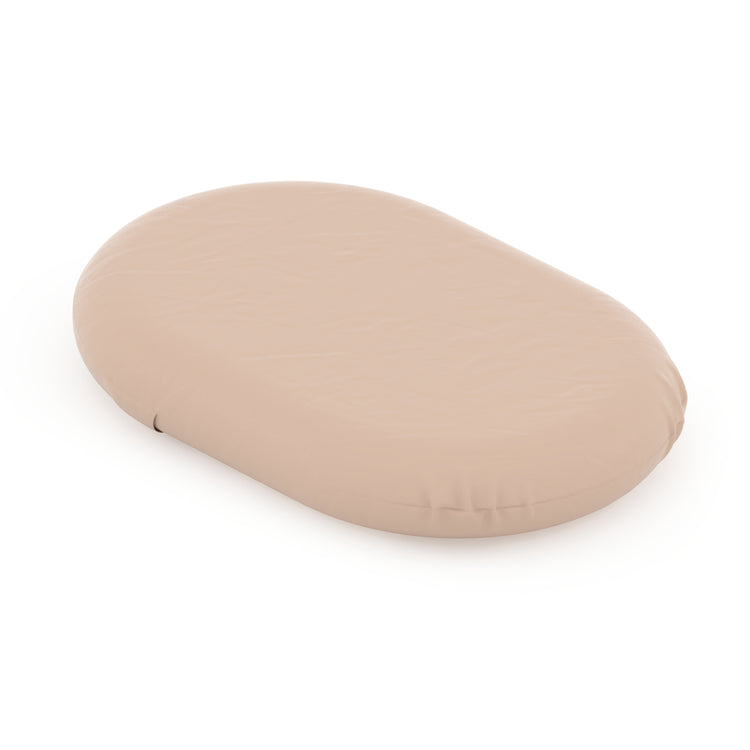 Beige oval-shaped object on a white background