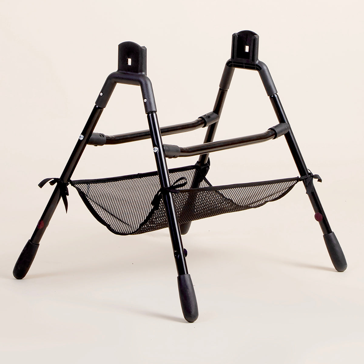 Full shot of Mountain Buggy carrycot plus stand on a white background