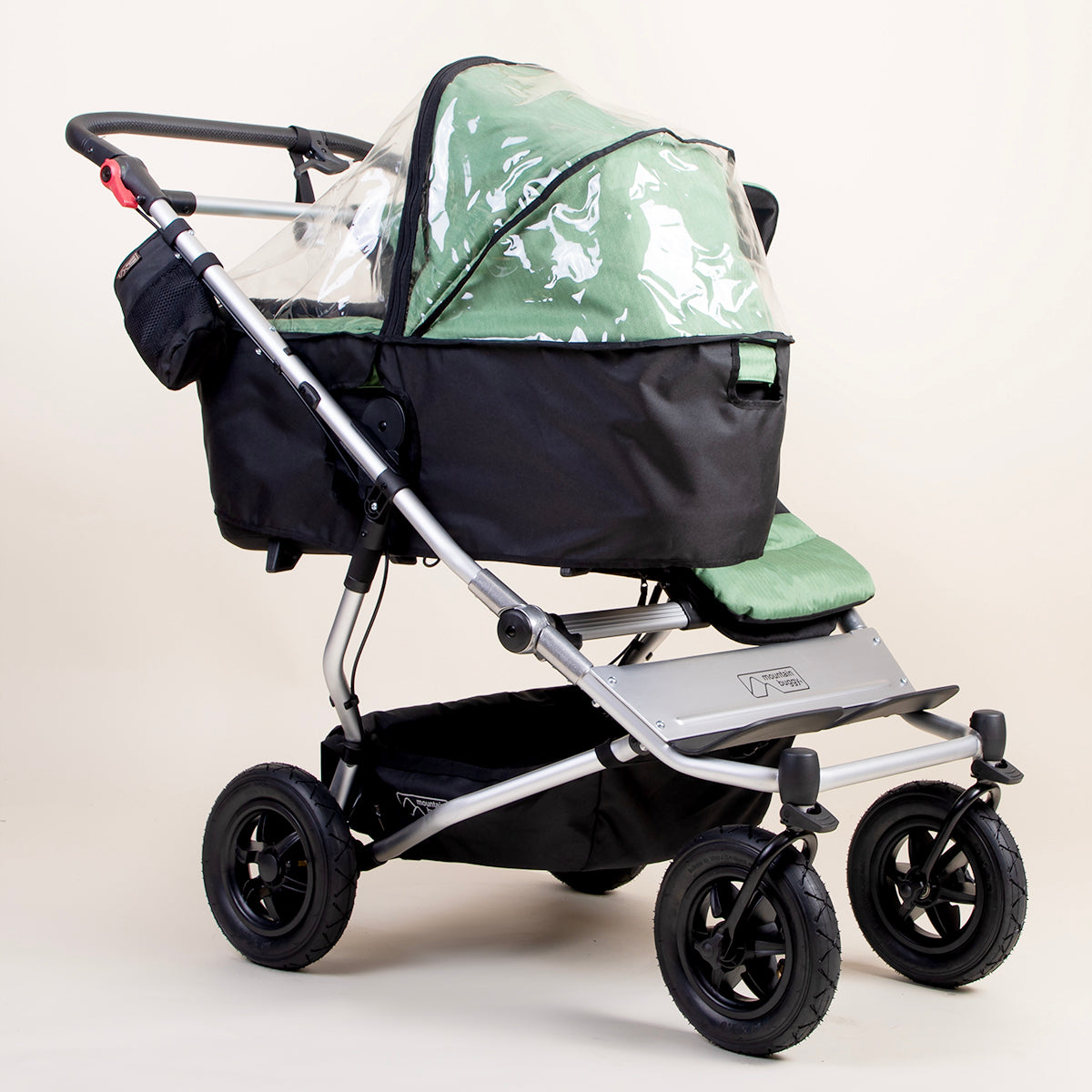 full shot of a mountain buggy duet carrycot plus storm cover on a matcha carrycot plus next to a duet seat 