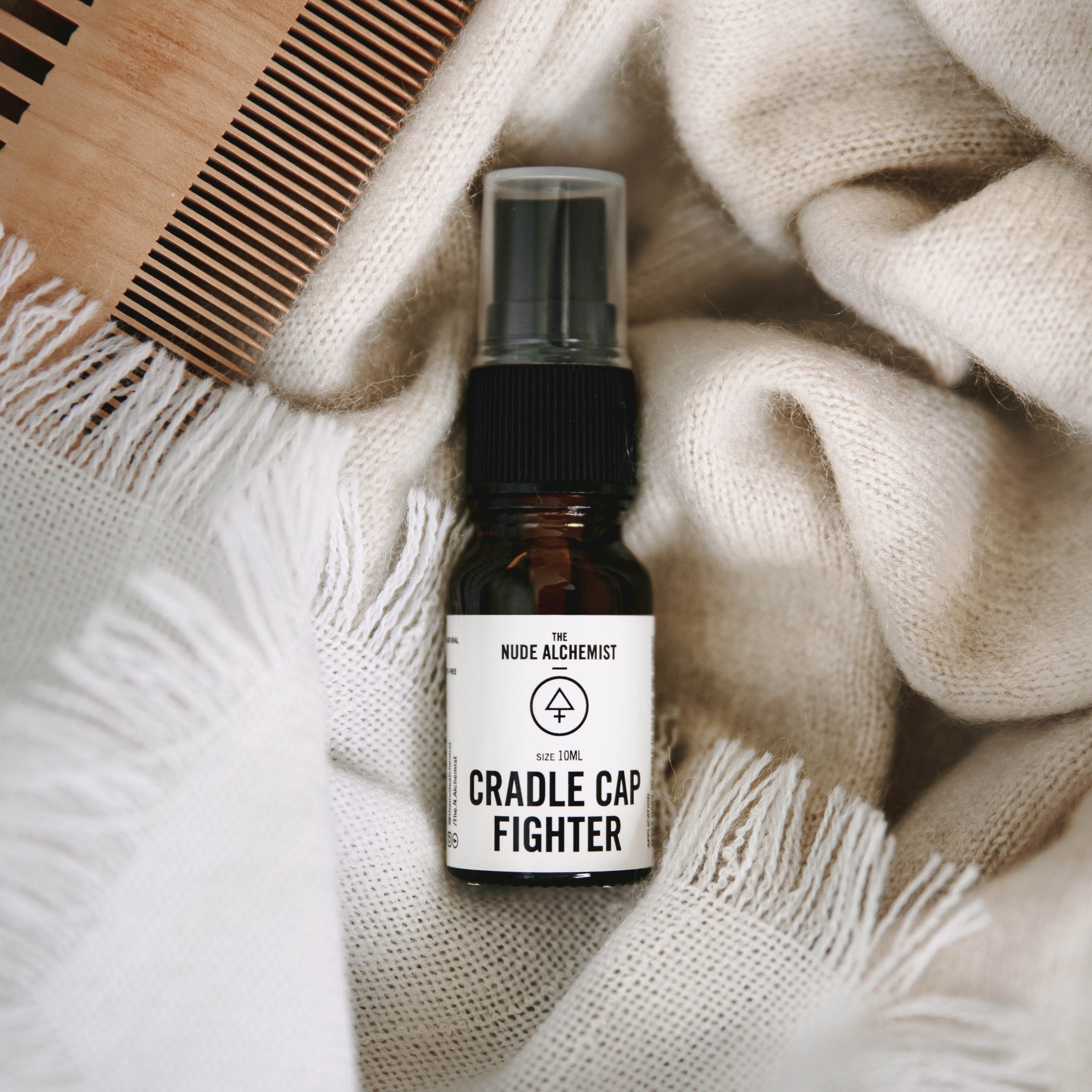 The Nude Alchemist Cradle Cap Fighter 10ml – natural cradle cap oil serum for baby scalp care.