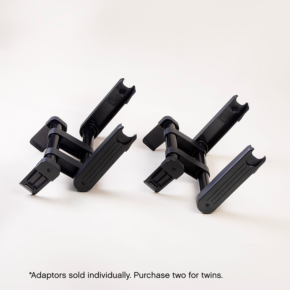 side view of mountain buggy car seat adaptors shown side by side