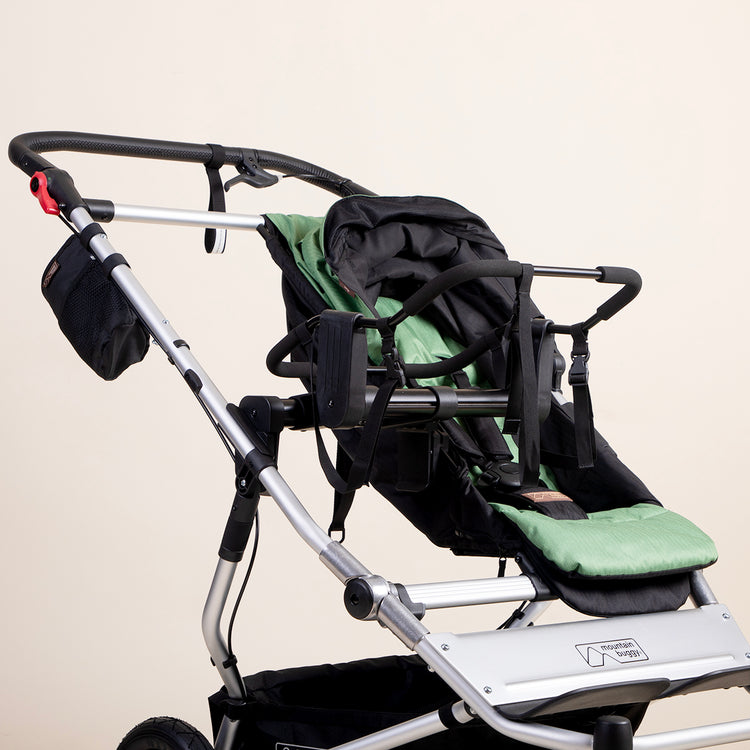 full shot view of mountain buggy duet with a universal car seat adaptor installed alongside a standard matcha coloured seat on a white background