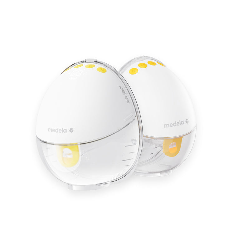 Two white baby bottles with yellow accents on a white background