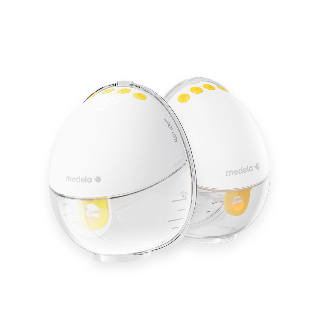 Two white baby bottles with yellow accents on a white background