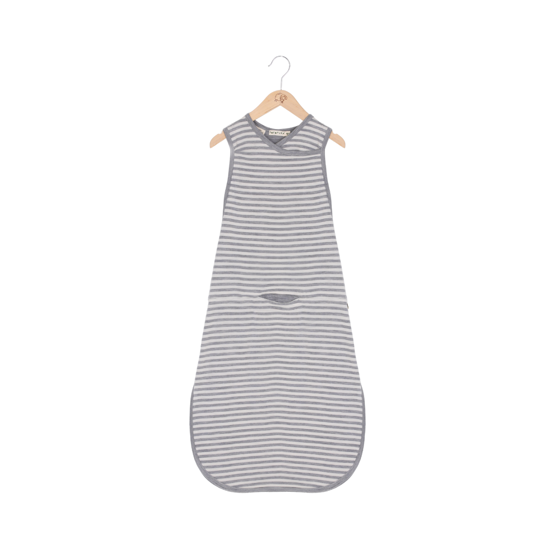 Striped baby sleeping bag on a hanger against a white background
