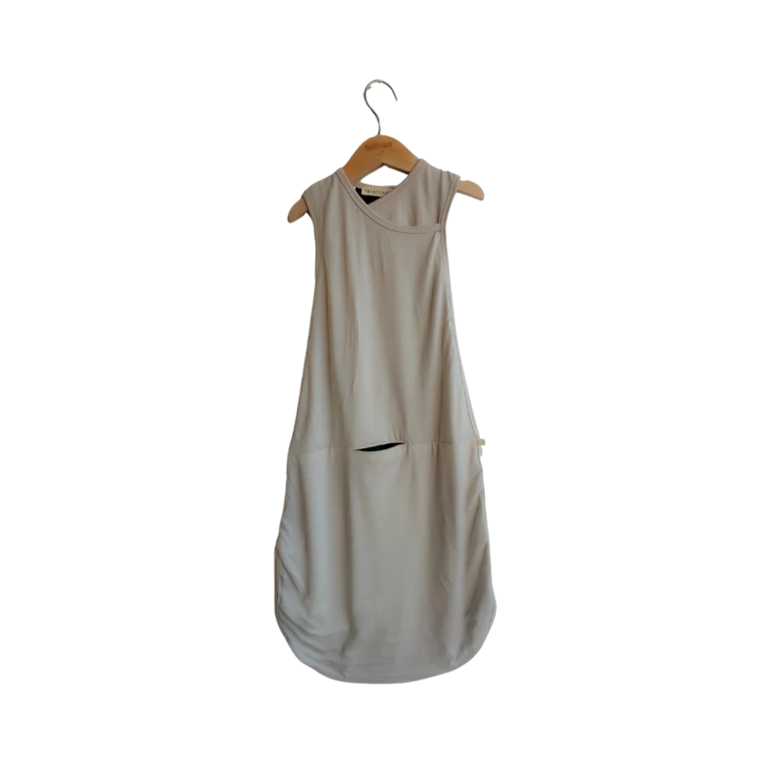Beige sleeveless dress on a wooden hanger against a white background