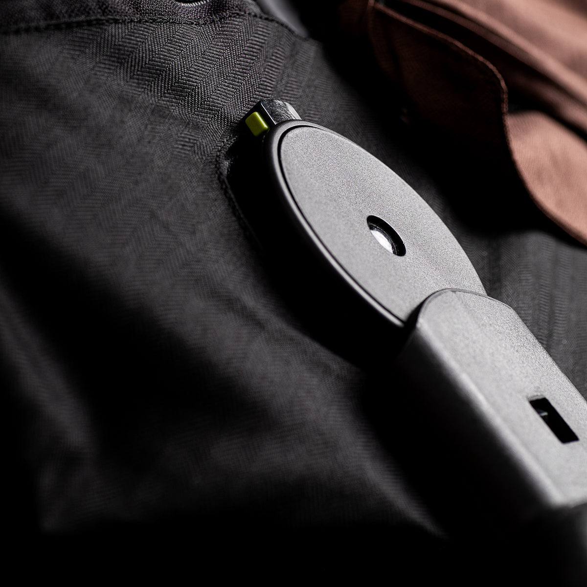 close up of the Mountain Buggy urban jungle carrycot plus in mustang brown showing the new clip attachments 