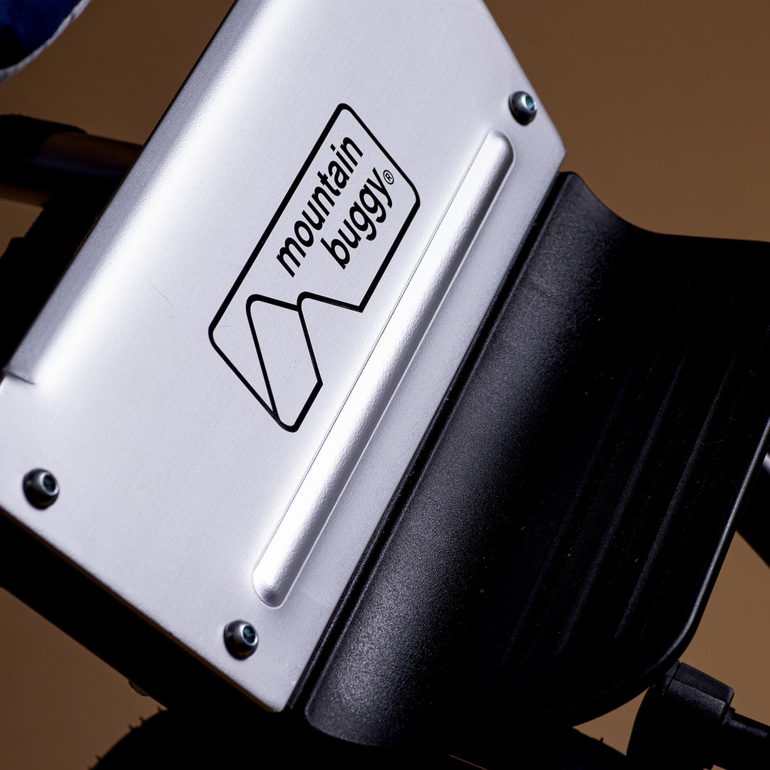 Close up of the Mountain Buggy logo at the base of the Mountain Buggy terrain seat