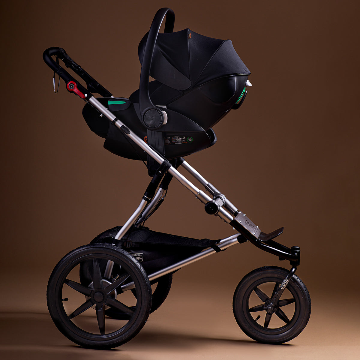 Full shot of the Mountain Buggy terrain travel system on a brown background