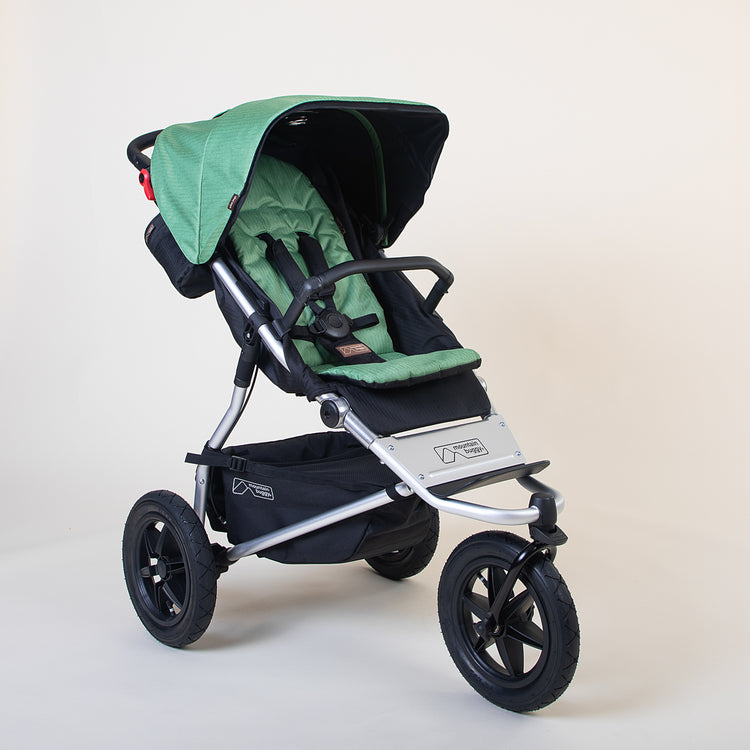 Full shot of the Mountain Buggy urban jungle in matcha green shown on a white background