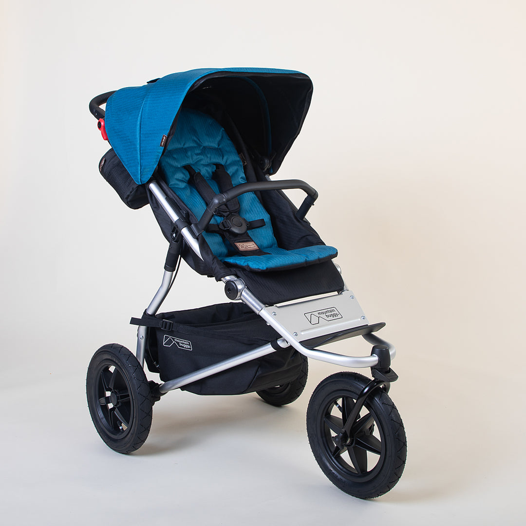 Full shot of the Mountain Buggy urban jungle in ocean blue shown on a white background