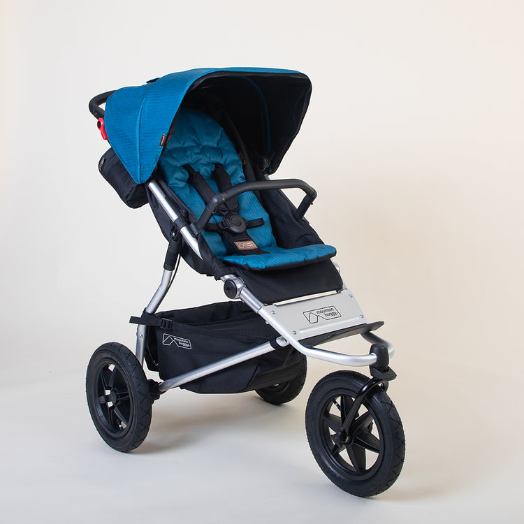 Full shot of the Mountain Buggy urban jungle in ocean blue shown on a white background