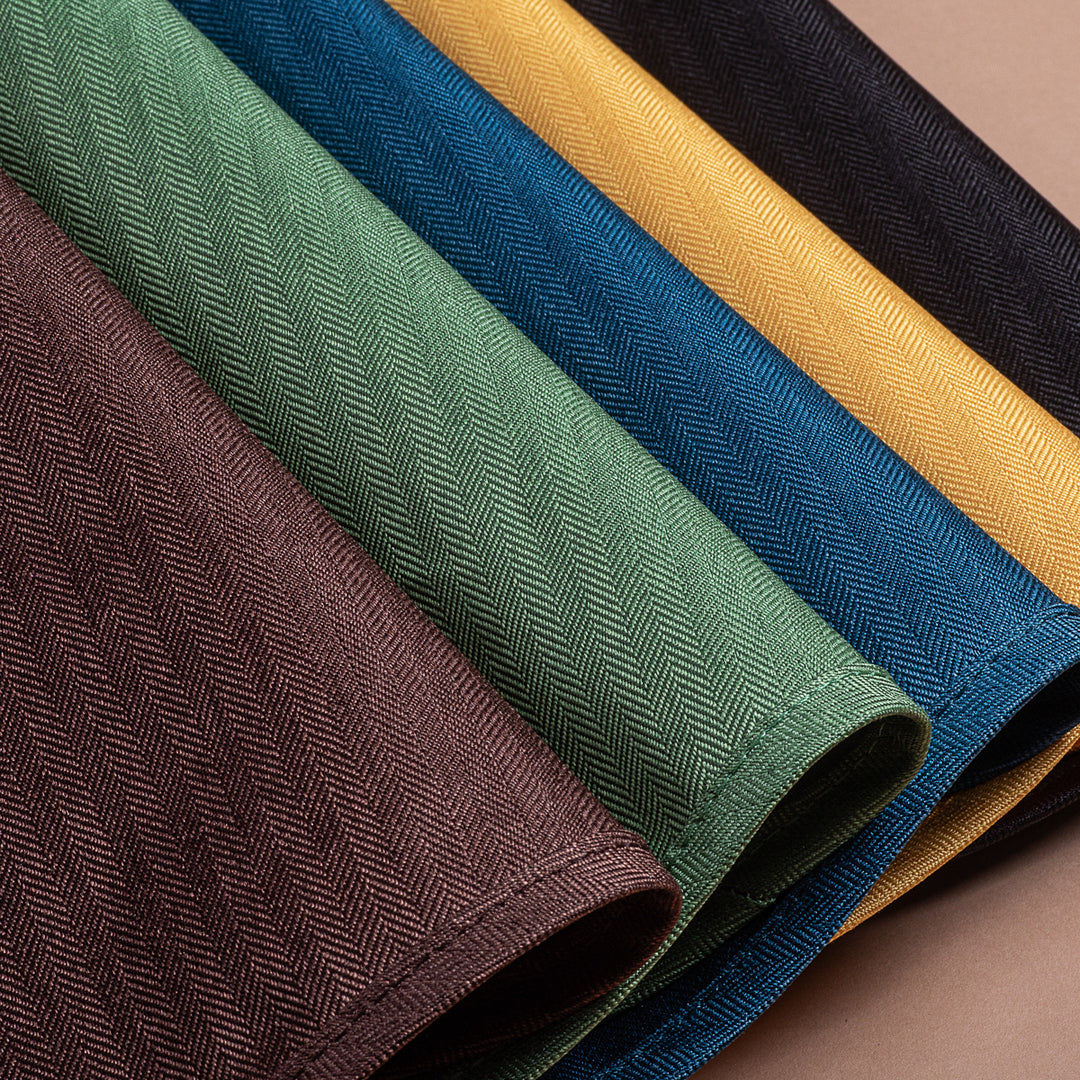 Close-up of Mountain Buggy Duet colour options on a brown background