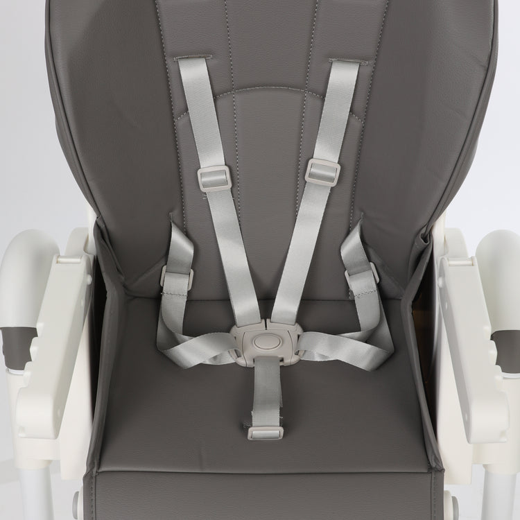 ORIGIN Marigold highchair closeup view showing safety harness on white background