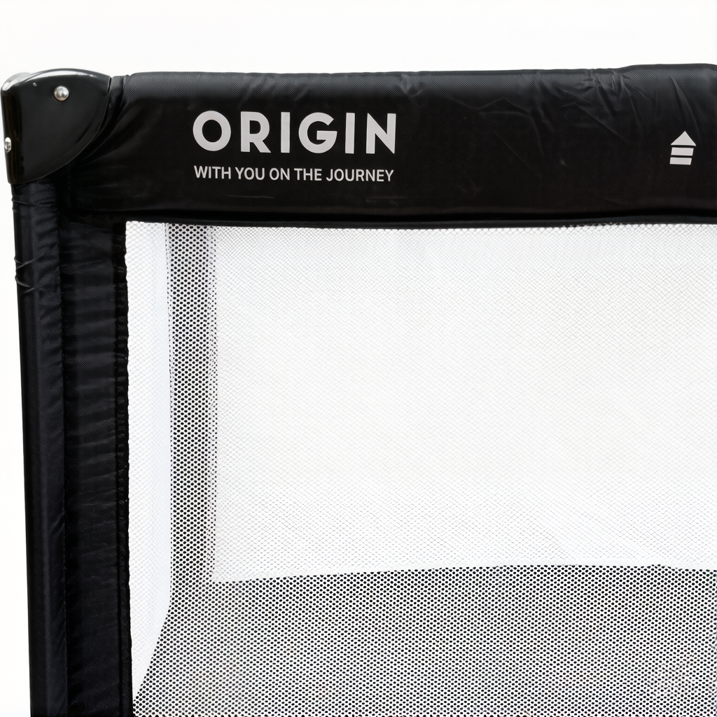 Close up of ORIGIN Weka portacot showing mesh side and logo