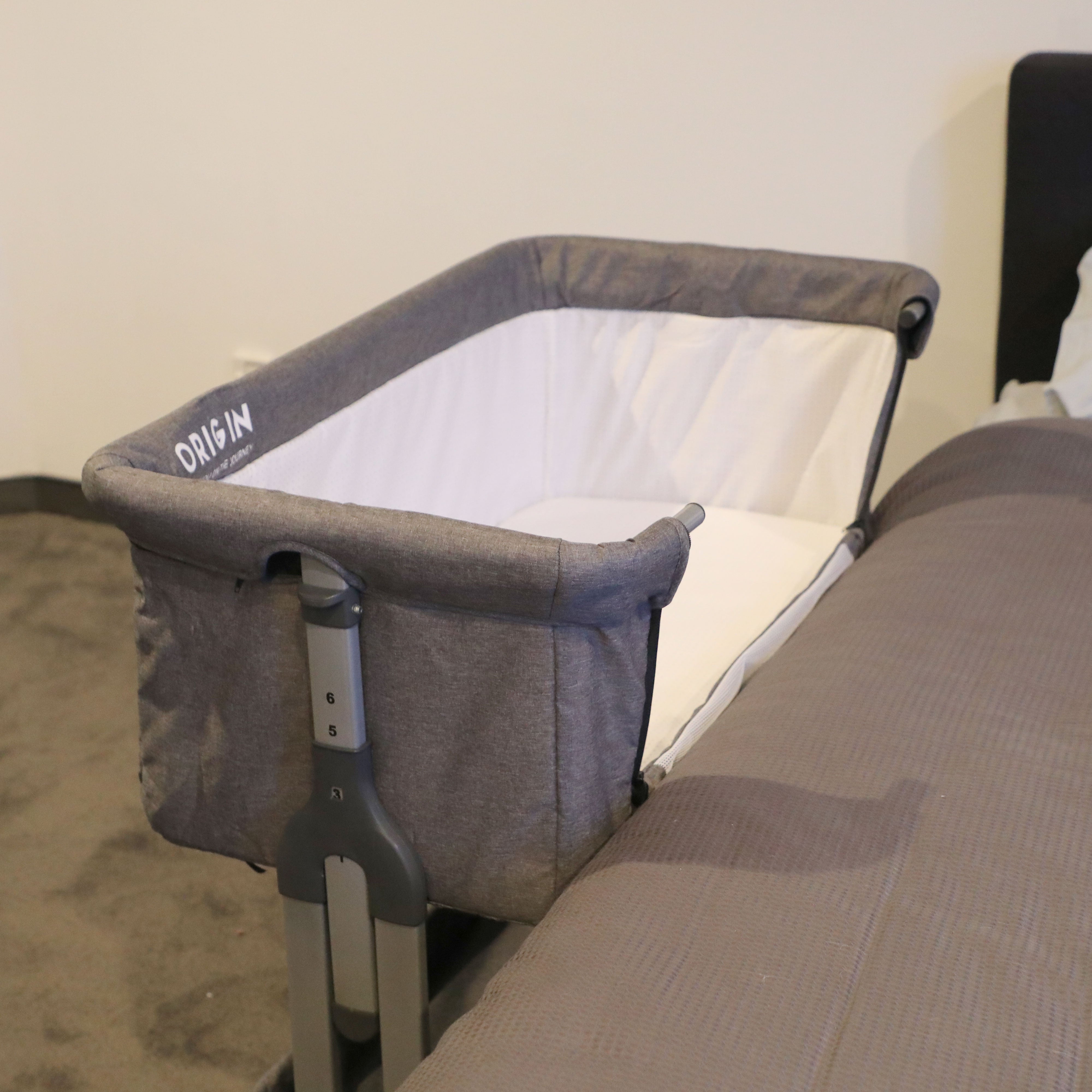 ORIGIN co-sleeper attached beside adult bed for safe baby sleeping