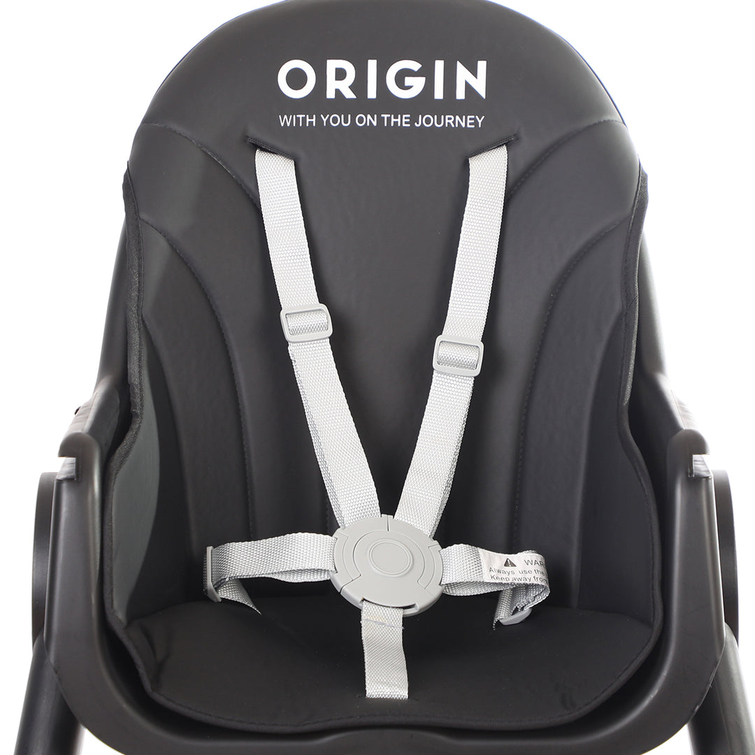 Close-up of ORIGIN Manuka Highchair showing harness with raised edges.