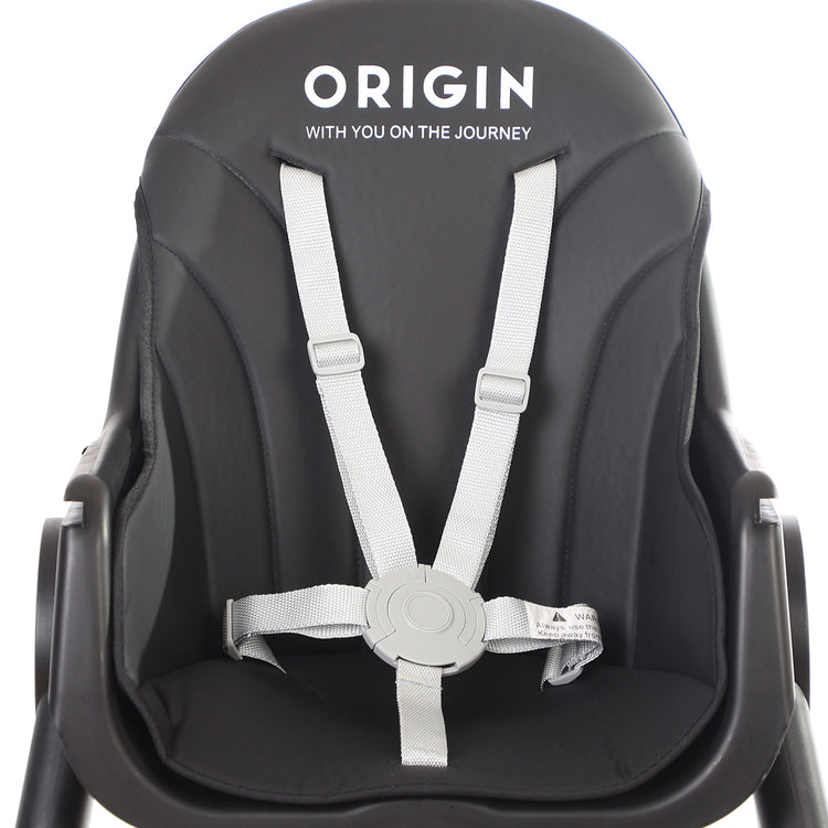 Close-up of ORIGIN Manuka Highchair showing harness with raised edges.
