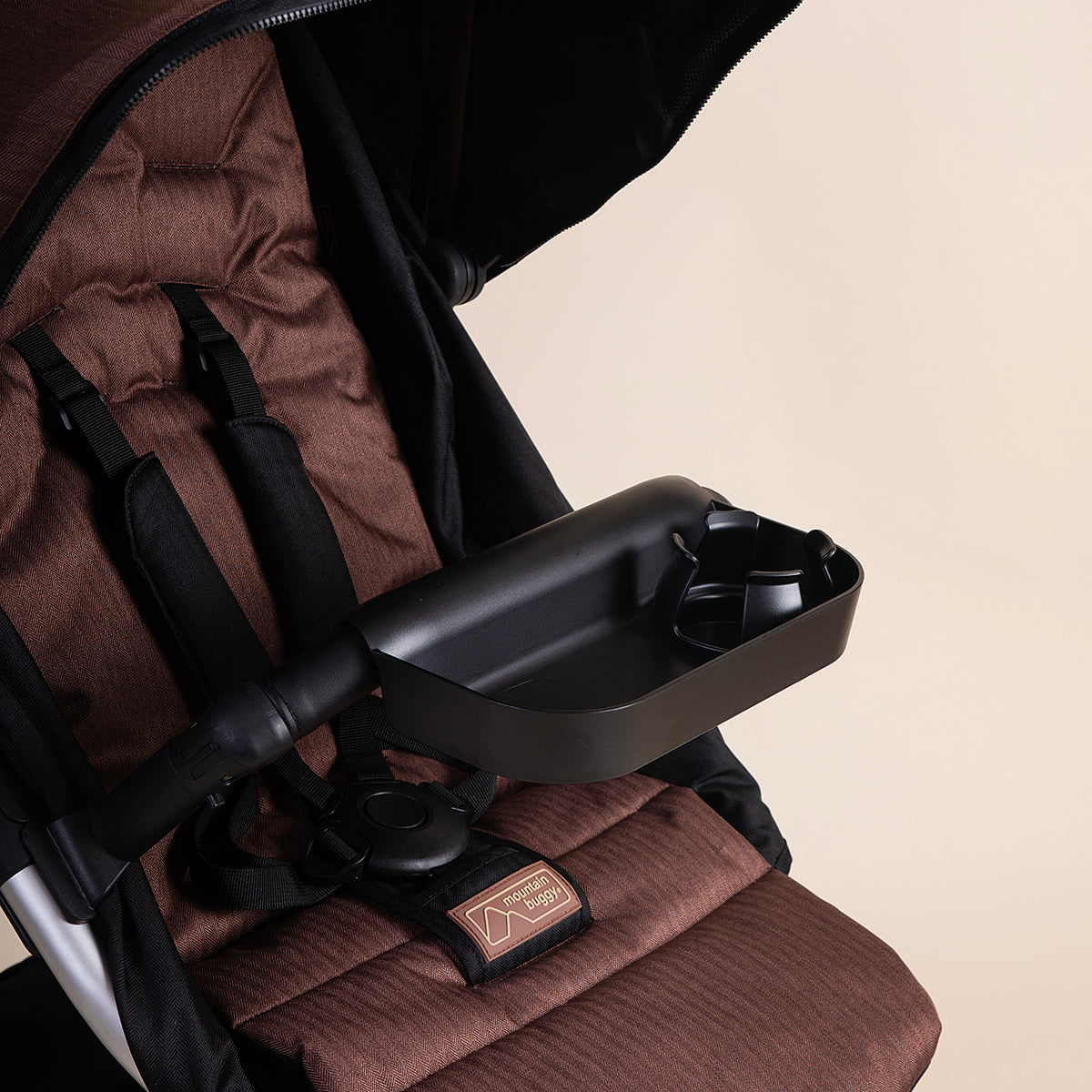 Full shot of Mountain Buggy foodtray in use on a Mountain Buggy urban jungle a white background