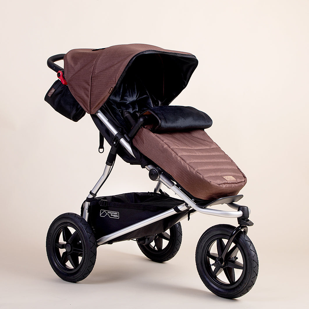 Full shot of Mountain Buggy urban jungle footmuff in colour mustang