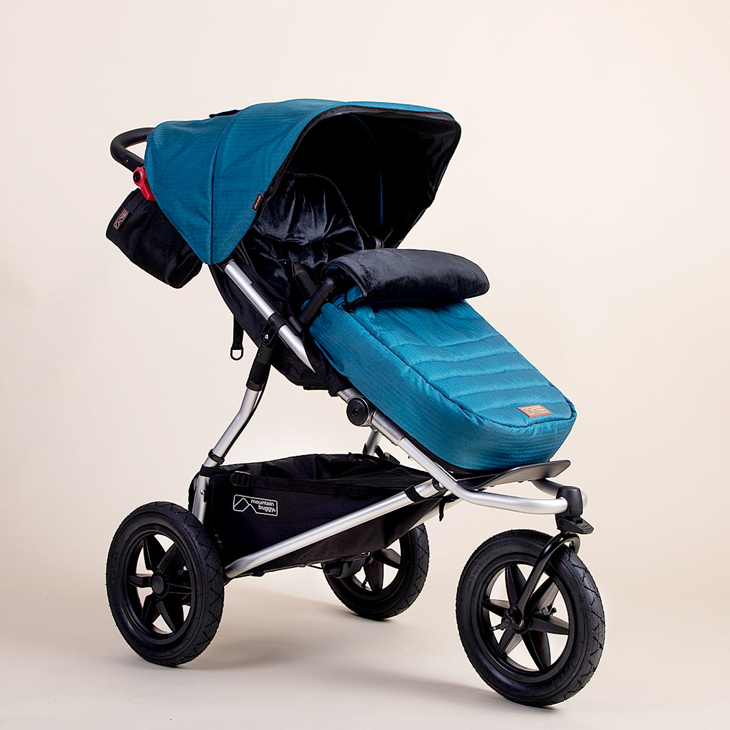 Full shot of Mountain Buggy urban jungle footmuff in colour ocean