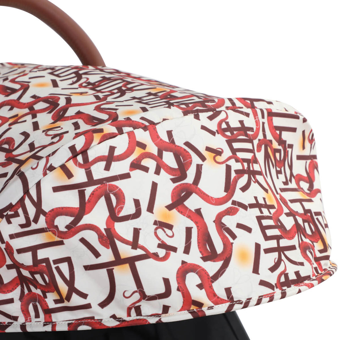 Closeup shot of the Mountain Buggy nano urban in Year of The snakeshowing the pattern