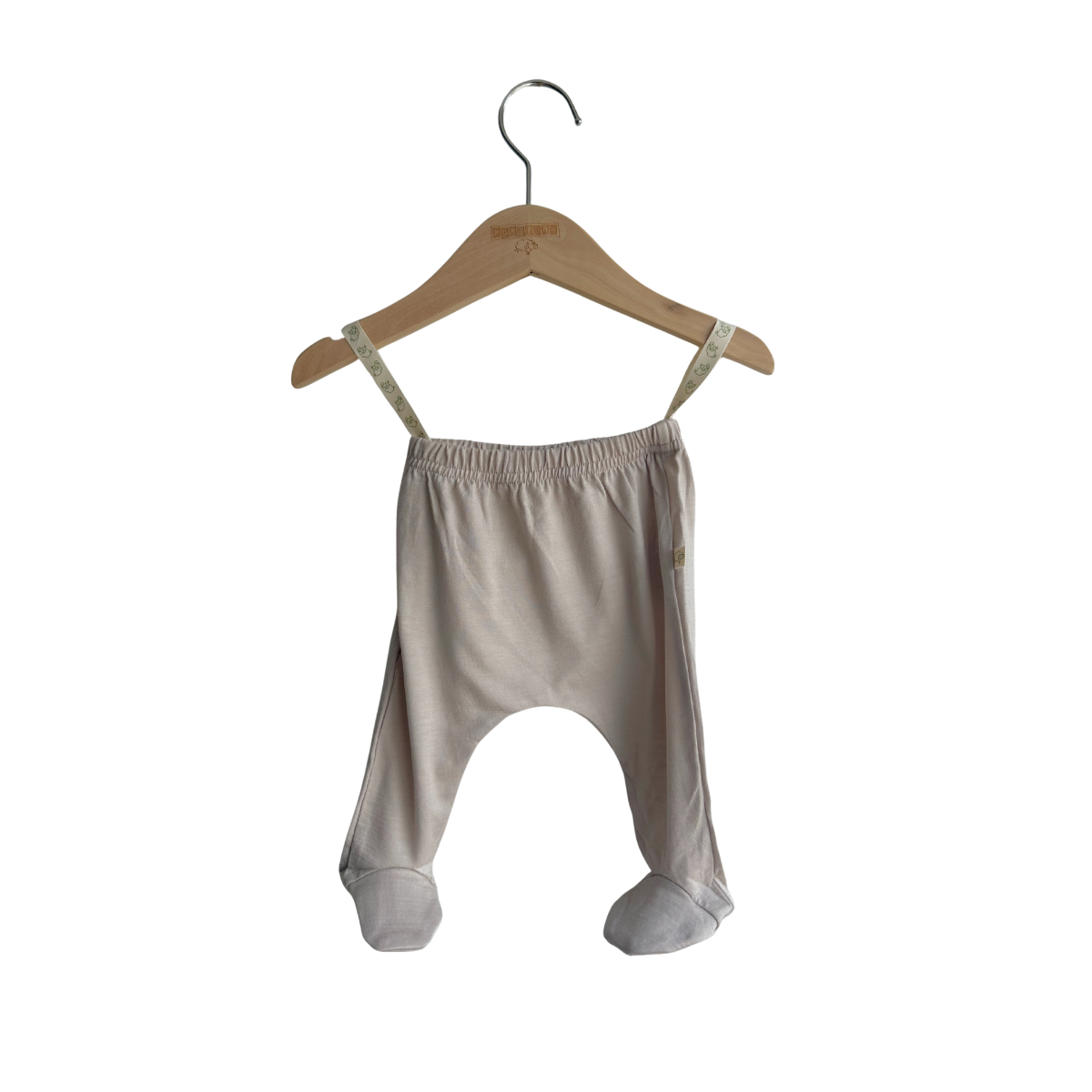 Baby harem pants on a wooden hanger against a white background