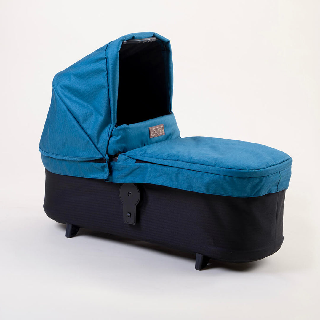 Full shot of Mountain Buggy carry cot plus for duet in ocean blue on white background