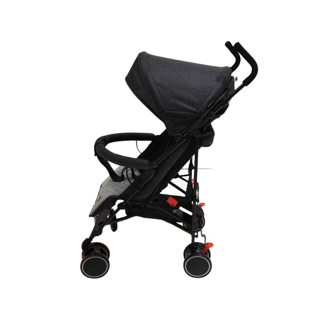 Side view of black stroller with four wheels and sun shade with a white background