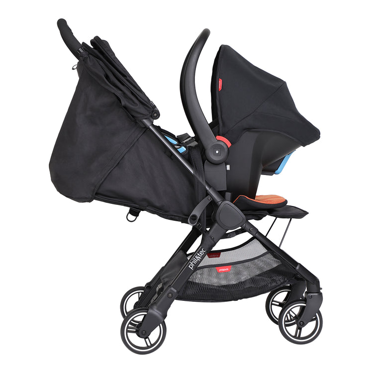 go™ 2020+ compact umbrella stroller with rust coloured liner from side angle with capsule_apple