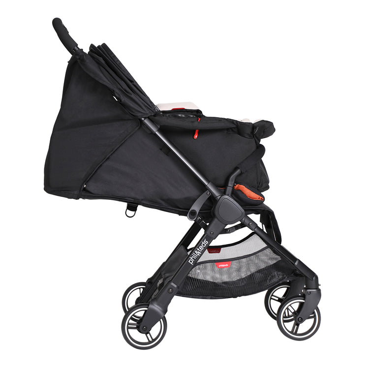 go™ 2020+ compact umbrella stroller with rust coloured liner from side angle with cocoon