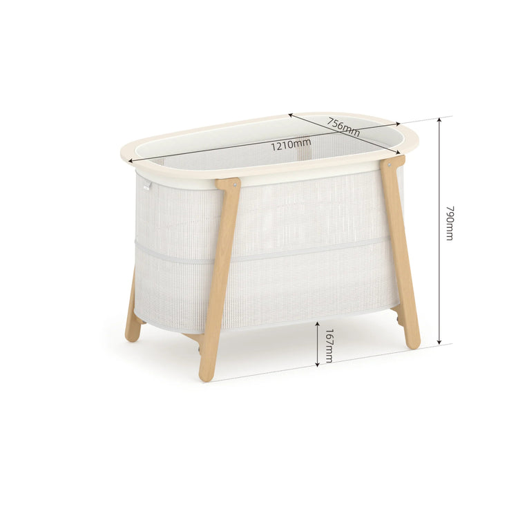 White crib with wooden legs and measurements on a white background