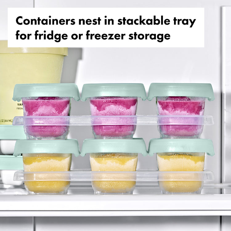 Stackable tray with containers for fridge or freezer storage, showing colorful contents.