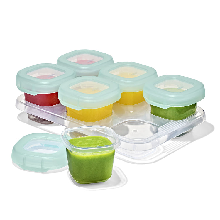 Set of baby food storage containers with colorful lids on a white background