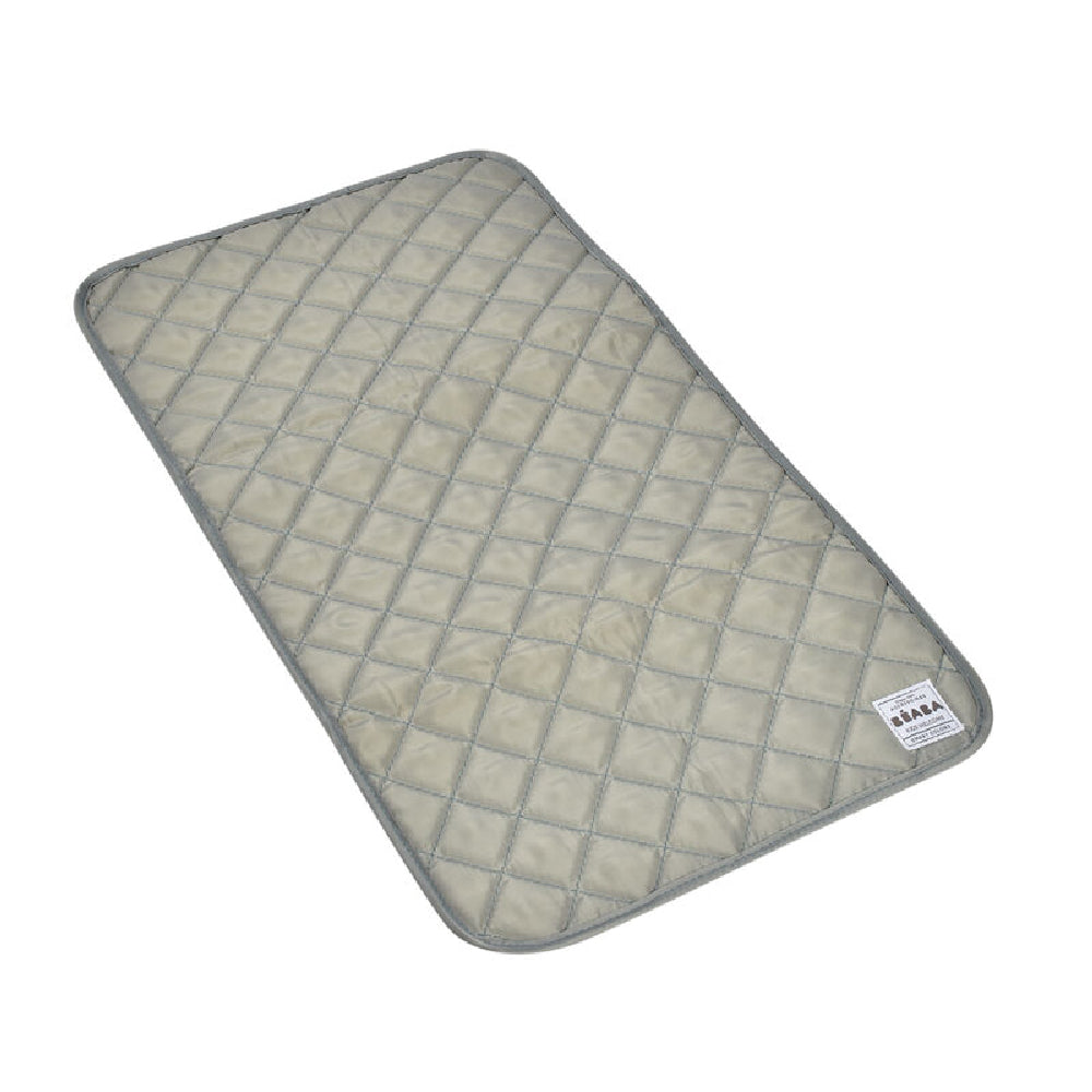Quilted mat with a grid pattern on a white background