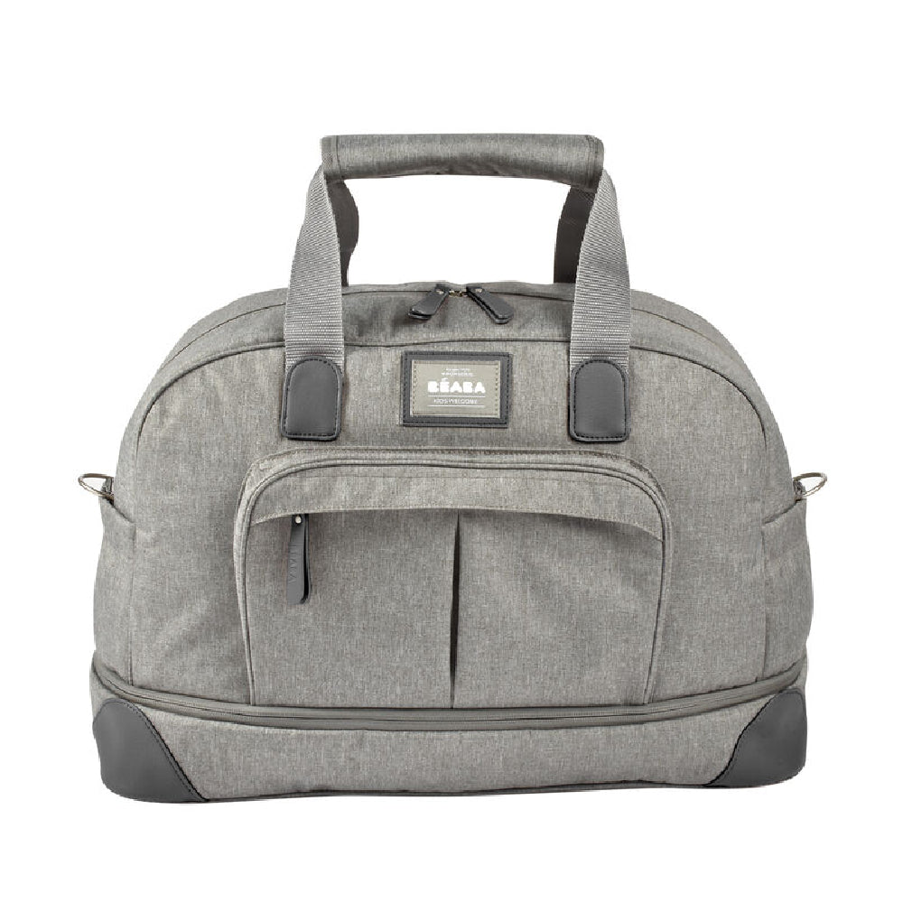 Gray duffel bag with a visible brand label on a white background