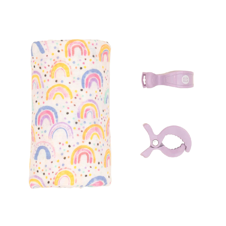 Baby bottle holder with rainbow pattern and accessories on a white background