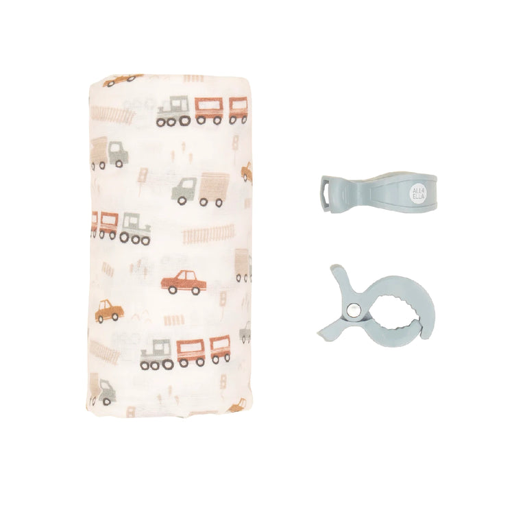 Baby swaddle with vehicle pattern and two clips on a white background