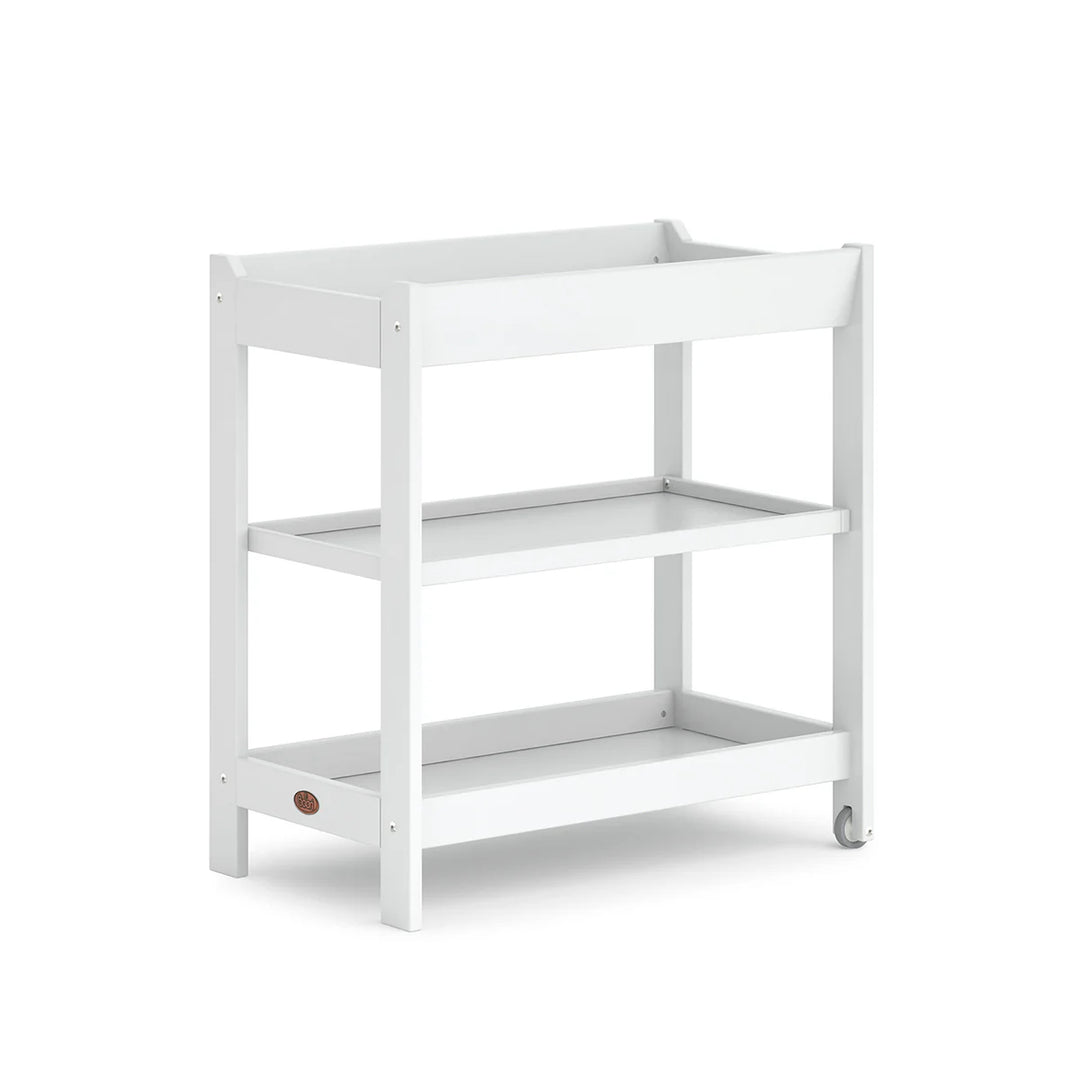 White baby changing table with a visible brand logo on a white background