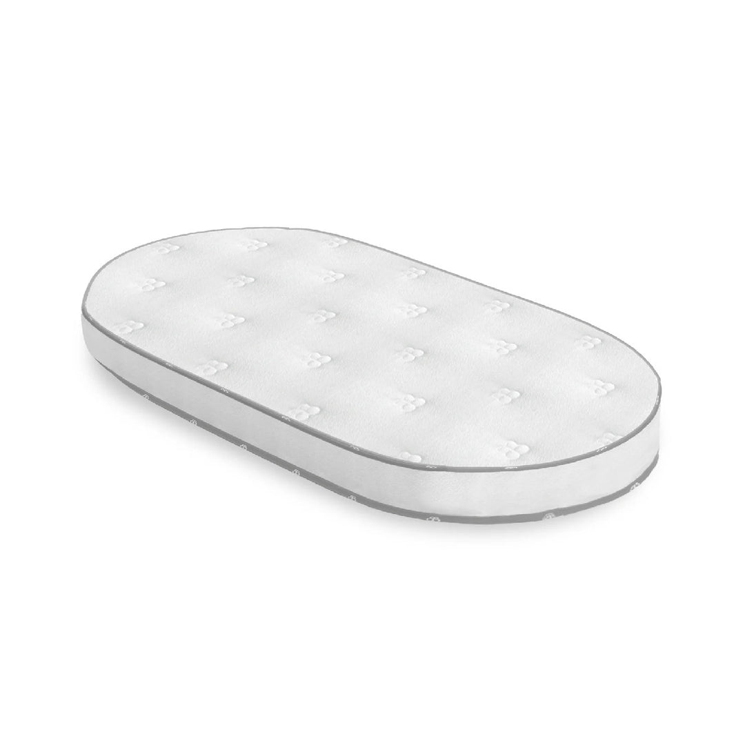 White oval-shaped product with small holes on a white background