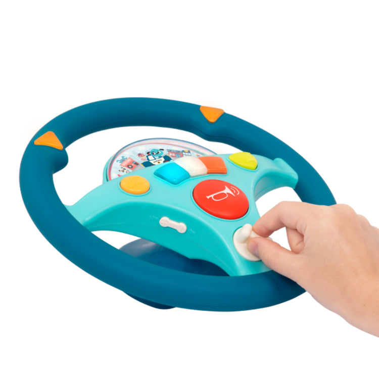 Toy steering wheel with colorful buttons on a white background