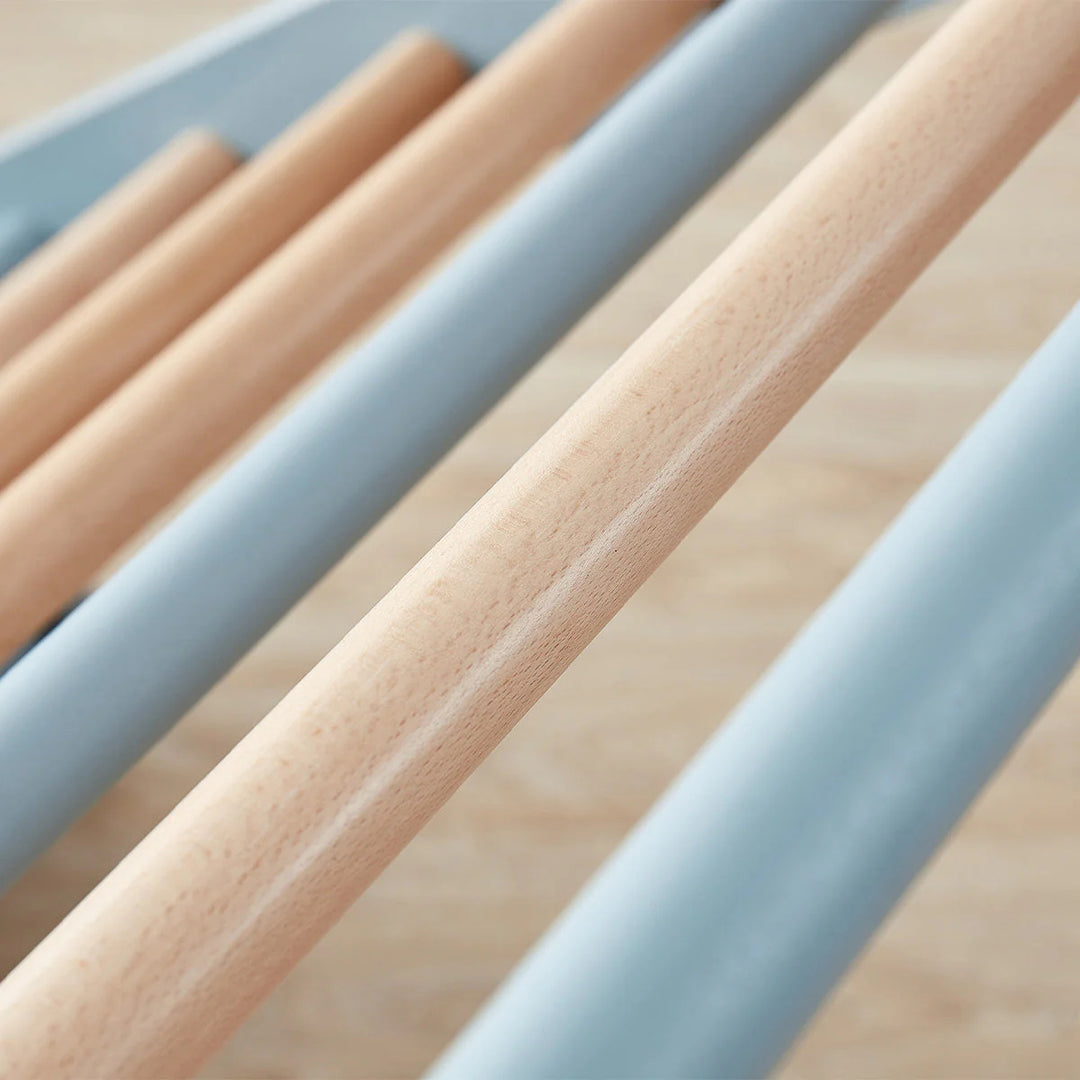 Close-up of wooden sticks with a light wood finish on a neutral background