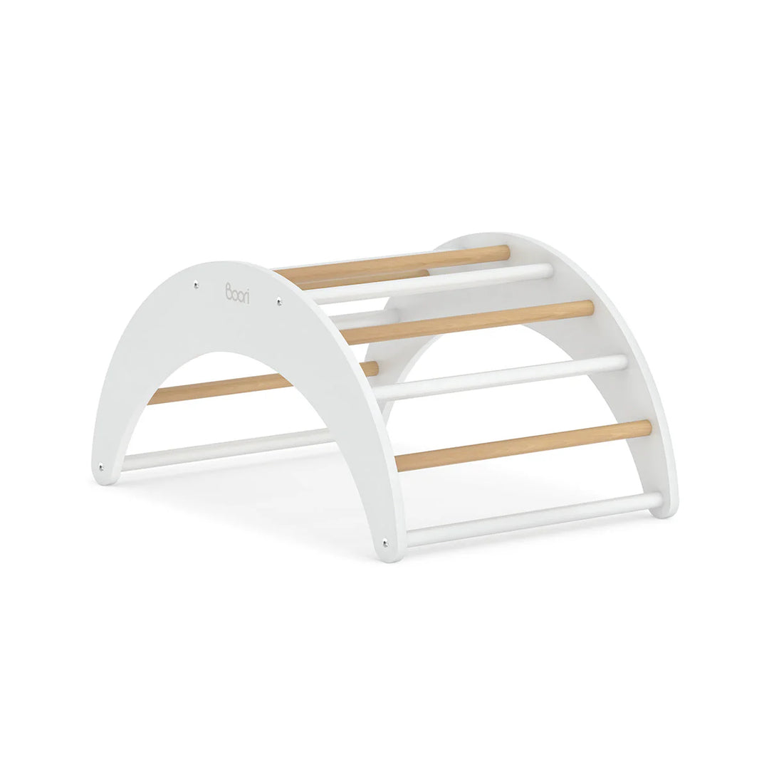 White baby rocker with wooden bars on a white background