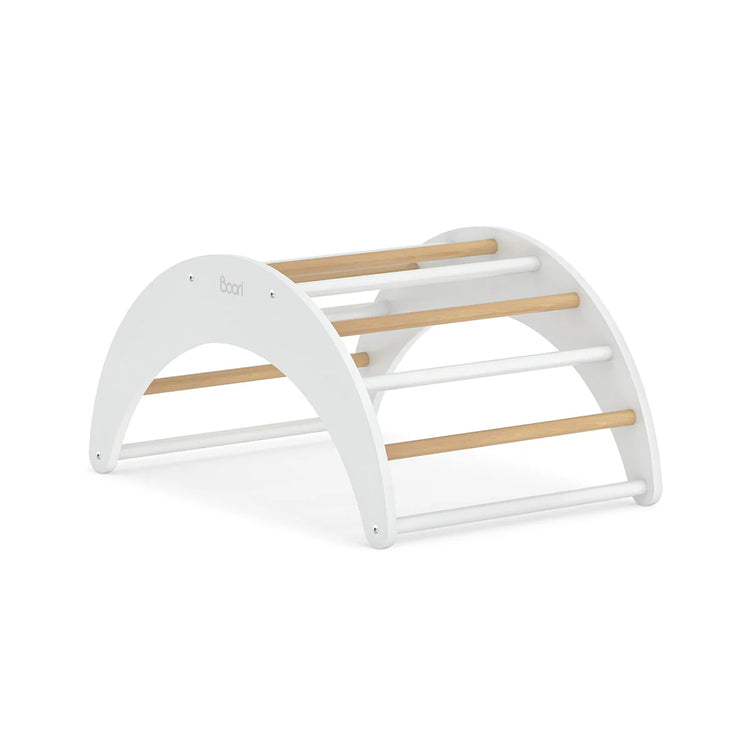 White baby rocker with wooden bars on a white background