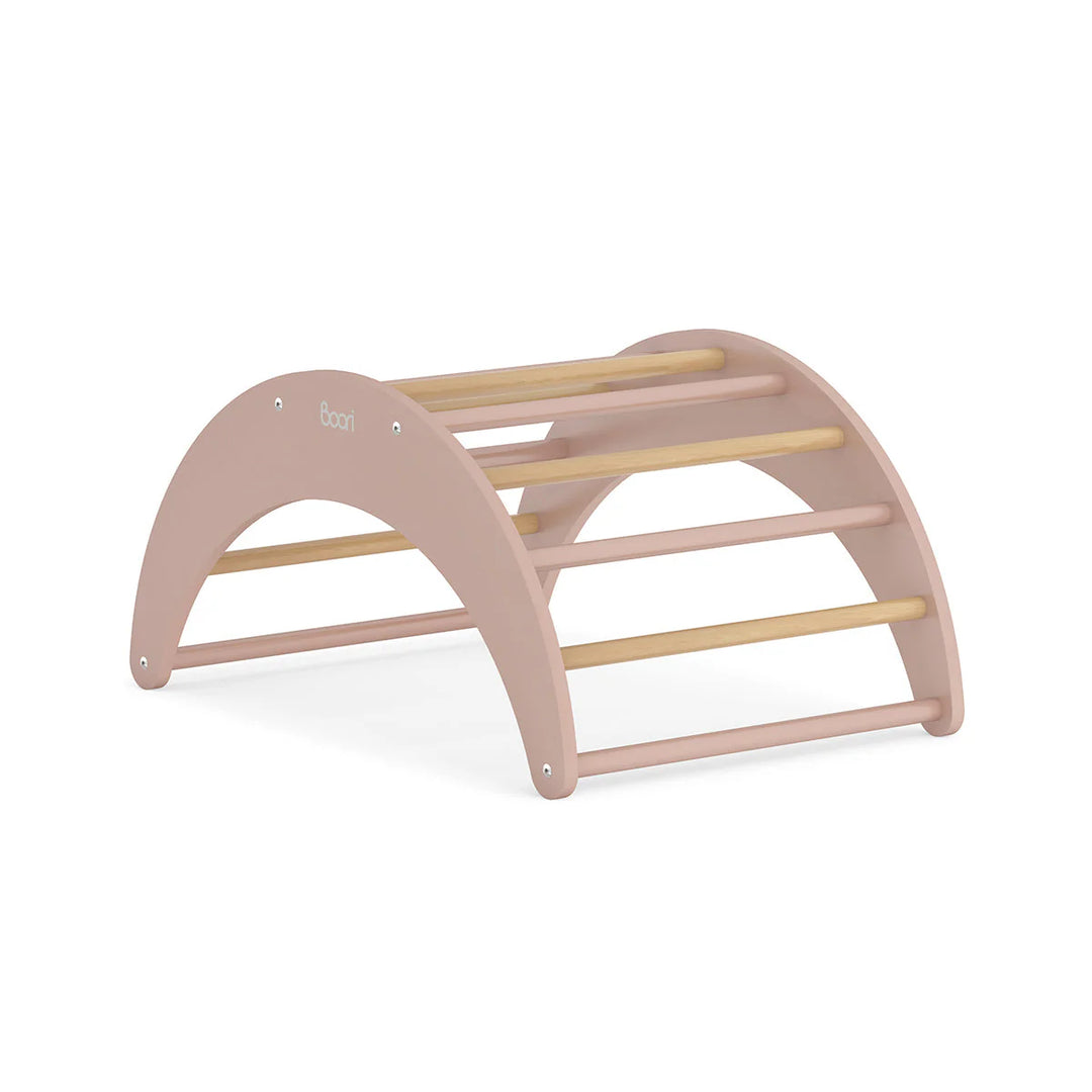 Pink and wooden children's rocker on a white background