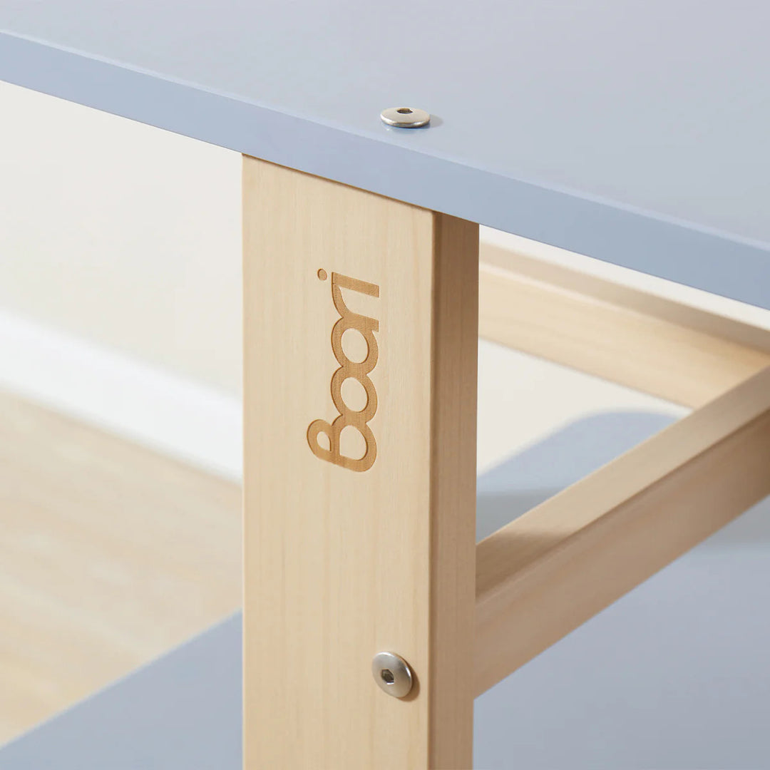 Close-up of a table with 'Boori' branding on the leg.