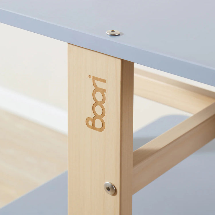 Close-up of a table with 'Boori' branding on the leg.